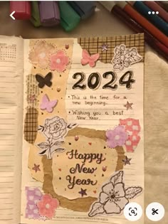 an open notebook with the words happy new year on it