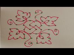 a drawing with red and green designs on white paper