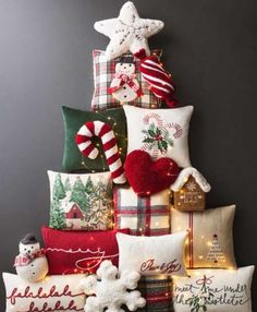 a christmas tree made out of pillows and other holiday decorations