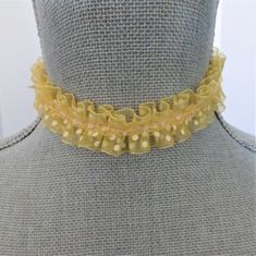 "Vintage organza ruffled yellow, and cream dotted ribbon makes up this costume choker necklace. Ribbon is stitched with a cream color satin ribbon, and they are linked with silver bars and an extension chain for adjustable sizing between 12 1/2\" and 14 1/2\". There is a glass yellow bead dangle on the chain.   All of my jewelry items come boxed, and ribbon tied and tagged for easy gifting." Elegant Yellow Choker As A Gift, Elegant Yellow Choker For Gifts, Ribbon Choker Necklace, Yellow Costume, Ribbon Choker, Ribbon Necklace, Yellow Polka Dot, Yellow Ribbon, How To Make Ribbon