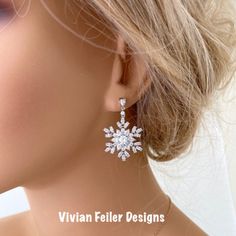 Snowflake Earrings Winter Wedding Bridal Jewelry Cubic Zirconia Sparkly Charming And Sparkle Like Diamonds! These Earrings Feature Tons Of Sparkling Clear Cubic Zirconia Stones Forming Together Given A Snowflake Like Design. Set In Beautiful Rhodium (White Gold) Finish Over Brass. They Sparkle Amazingly ! Perfect For A Winter Wedding Or Special Occasion ! Earrings Posts Are Sterling Silver. The Components Are High Quality Luster Rhodium Plated Over Brass - Tarnish Resistant, Lead Free, Nickel Fr Christmas Wedding Jewelry, Elegant Christmas Drop Earrings, White Snowflake Wedding Earrings, Elegant Snowflake Jewelry For Formal Occasions, Elegant Snowflake Shaped Cubic Zirconia Jewelry, Elegant Christmas Jewelry With Matching Earrings, Elegant Snowflake Earrings For Parties, Elegant Snowflake Jewelry For Party, Elegant Silver Christmas Earrings