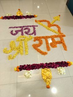 flowers laid out on the floor with words written in different languages and colors around them