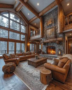 a large living room filled with furniture and a fire place in the middle of it