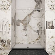 a bathroom with marble walls and flooring in the shower area, including a black rug