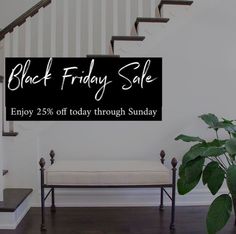 a black friday sale sign in front of a stair case