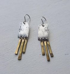 Relic Fringe Earrings Mixed metal silver and gold | Etsy Artisan Silver Brass Earrings, Handmade Mixed Metal Silver Earrings, Modern Brass Earrings With Oxidized Finish, Hammered Silver Brass Earrings, Silver Hammered Brass Earrings, Artisan Sterling Silver Bronze Earrings, Silver Brass Plug Earrings, Artisan Bronze Sterling Silver Earrings, Hand Forged Silver Brass Earrings