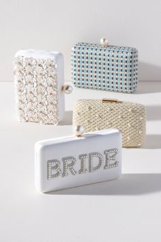 Bring your bridal celebrations wherever you go with Shiraleah's "Bride" Pearl Minaudiere. This classic white purse features the word "Bride" embroidered in chic faux pearls with a faux pearl top closure. You can carry it like a clutch or use the detachable cross-body chain for some extra versatility in your style. Pair with other items from Shiraleah's Hitched collection to complete your look! Features a detachable cross-body chain and a magnetic frame closure Shiraleah is a trend-driven lifesty White Evening Bag With Pearl Embroidery For Events, White Bridal Accessories With Pearl Embroidery For Formal, White Bridal Accessories With Pearl Embroidery For Formal Occasions, White Pearl Embroidered Clutch For Formal Occasions, White Pearl Embroidery Clutch For Formal Occasions, Formal White Clutch With Pearl Embroidery, White Rectangular Clutch With Pearl Embroidery, White Pearl Clutch For Events, Chic White Evening Bag For Wedding