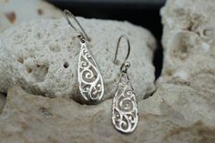 This is the perfect option for those who like cool, unique jewelry and the luxury, shine of silver. The pierced earrings have the shape of drops. The earrings have carved ornament. It is perfect for a gift for birthday, mother's day and holidays. ❤️ The earrings are about 1 2/4'' with loops by 3/8''(in the widest place). ❤️ There is a hallmark: 925. SU.Thailand. ❤️One earring is a little crumpled. Everyone interested in the jewelry should remember that he or she must like their jewelry- not just Unique Sterling Silver Pierced Earrings, Unique Drop Earrings For Pierced Ears, Unique White Gold Pierced Earrings, Handmade Silver Teardrop Earrings For Anniversary, Silver Sterling Silver Drop Earrings, Unique Silver Dangle Teardrop Earrings, Unique Silver Teardrop Dangle Earrings, Unique Handmade Sterling Silver Teardrop Earrings, Sterling Silver Teardrop Pierced Earrings