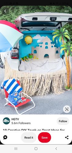 the back of a car with its trunk open and an umbrella in front of it