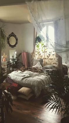 a bed room with a neatly made bed and lots of plants