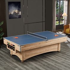 a ping pong table in the middle of a living room