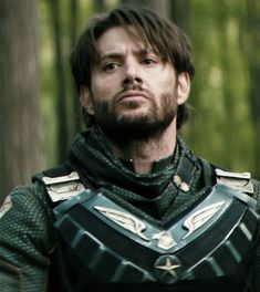 a man dressed as loki in the woods