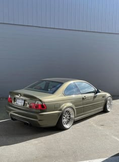 a silver car parked in front of a building