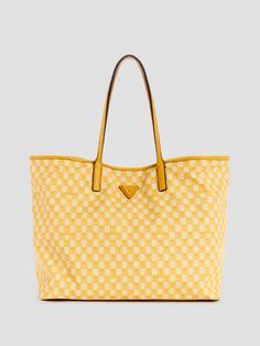 Faux-leather tote set G Wave pattern Shiny gold-tone hardware Enamel signature emblem Single-compartment construction Lined interior Magnetic snap-button closure Included zip pouch Dual top handles with 10" drop 15.5"W x 13.5"H x 7.75"D Luxury Yellow Bag With Zipper Closure, Luxury Yellow Bags With Zipper Closure, Gold Rectangular Coated Canvas Bags, Gold Coated Canvas Bag With Double Handle, Gold Bags With Gold-tone Hardware In Coated Canvas, Gold Bags With Gold-tone Hardware And Coated Canvas, Gold Coated Canvas Tote Bag, Gold Coated Canvas Bags For Daily Use, Gold Coated Canvas Bag For Travel