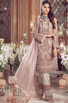 The new party and festive wear collection is geared up with chiffon embroidered Pakistani eid formal dress. You can buy lavish fancy wear online to adorn your special event look in an elegant way. Shirt: This lavish attire is highlighting its grace with lavish silver color embroidered panels for shirt. Chiffon shirt is embellished with hand embellishments and organza work in beautiful patterns. Embroidered chiffon sleeves are designed with organza embroidered borders. Front and front back of shi Eid Dresses, Chiffon Collection, Pakistani Suits, Fabric Stores Online, Pakistani Fashion, Designer Suits, Pakistani Dresses, Festival Wear, Party Wear