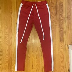 Never Worn Before Red Stretch Sporty Joggers, Sporty Stretch Red Joggers, Red Stretch Joggers For Streetwear, Sporty Red Pants With Side Stripes, Red Sweatpants For Spring Streetwear, Spring Red Sweatpants For Streetwear, Red Stretch Sweatpants For Streetwear, Red Sporty Sweatpants For Spring, Sporty Red Sweatpants For Spring