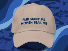 a hat that says fish want me women fear me on the front and blue background