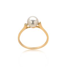 Show off your love for all things classy with this pearl solitaire ring in 14k gold. A lustrous round Freshwater cultured pearl is peg set between two glimmering diamond accents. The pearl centre stone fascinates with its gorgeous lustre, while the diamond accents enhance the overall beauty of this classic ring. Wear it alone or stack with other rings for enhanced style. Product specifications Jewelry Information Metal Stamp: 14k Metal: Yellow Gold Gem Type: White diamond Setting: Prong Ring Siz Black Panther Jewelry, Antique Wedding Ring, Engagement Ring Gold, Wedding Ring Diamond, Pearl Engagement Ring, Antique Wedding Rings, Pearl And Diamond Ring, Antique Wedding, June Birthstone