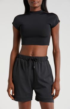 Cut from a double-layer knit with a banded hem, this cropped open-back T-shirt is supportive enough for the weight room and hot enough for the dance floor. Mock neck Short sleeves Nylon/spandex Machine wash, tumble dry Imported Cropped Sports T-shirt, Black Athleisure Cropped T-shirt For Workout, Sporty Black Crop Top T-shirt, High Stretch Casual Cropped T-shirt, Black Fitted Cropped T-shirt, Seamless Crew Neck Crop Top For Sports, Seamless Sports Crop Top With Crew Neck, Slightly Stretchable Black Sporty Top, Cropped Athleisure T-shirt For Workout