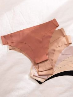 Discover ultimate comfort with our Pack Of 7 Solid No Show Panty Set. Embrace the sleek design, crafted for a seamless fit. Experience all-day ease with the bikinis-style panty, adorned with a subtle plain pattern. Each set includes 7 pieces, ensuring you have a panty for every day. The medium stretch fabric adds to the coziness and flexibility, making these panties a must-have addition to your wardrobe. Features: Pattern Type: Plain Panty Type: Bikinis Rise: Mid Rise Number of Pieces: 7-Piece S Solid Color Briefs With Elastic Band, Solid Color Briefs With Minimal Stretch, Solid Color Soft Touch Intimate Briefs, Solid Smooth Texture Intimate Briefs, Instagram Christmas, Sleek Design, Stretch Fabric, Mid Rise, Every Day