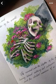 an open book with a drawing of a skeleton and flowers