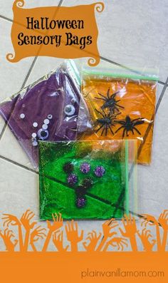 three bags filled with halloween themed items on top of a tile floor next to a sign that says, halloween sensory bags