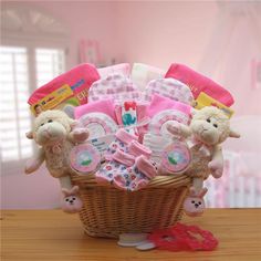 a basket filled with baby items on top of a wooden table