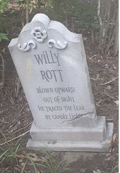 a headstone is shown in the grass