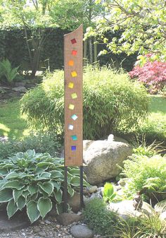 a garden with rocks and plants in it