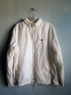 Vintage Puritan White Windbreaker Nylon Jacket,  Full Zip Up Long Sleeves with Hidden Hood, Size L Very good condition.  No holes, tears, snags or stains. Please review photos. Happy to answer questions on this item.  Size: Large White Windbreaker or Track/Boating Jacket Two front slit pockets with zipper closure Long sleeves  Drawstring at hem to keep out cold Hoodie enclosed in back of collar Lined Material:  Shell:  100% Nylon Lining: 100% Cotton Approx. measurements: Length: 26 inches Sleeve Hood Men, White Windbreaker, Hidden Hood, Large White, Boating, Zip Ups, Bathing Beauties, Track, Jackets & Coats