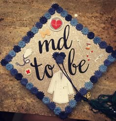 a decorated cap that says mad to be on the top of a granite countertop