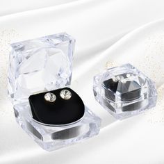 Display your earrings beautifully with the Sparkling Crystal Deluxe Earring Gift Box. Featuring a plush velour insert and transparent design, it keeps jewelry secure and dust-free, perfect for elegant jewelry display or gifting.  Exterior finish: Transparent Interior material: Velour Shop now!! Modern Jewelry Gift With Box Included, Modern Jewelry Gift Set With Box, Modern Jewelry For Gifts, Modern Jewelry Storage With Box Included For Gift, Modern Jewelry Storage Box As Gift, Modern Jewelry Storage Box As A Gift, Elegant Jewelry Storage With Dust Box For Gifts, Silver Jewelry Storage Box With Gift Box, Elegant Silver Jewelry Storage Gift