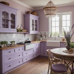 a kitchen with purple cabinets and white counter tops, wooden flooring and a chandelier hanging from the ceiling