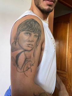 a man with a tattoo on his arm