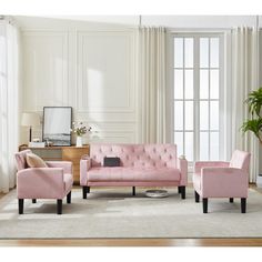 a living room with pink couches and chairs