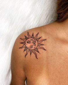 a woman with a sun tattoo on her shoulder