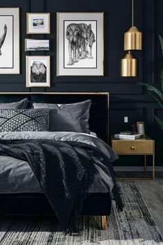 a bedroom with black walls and pictures on the wall above the bed, along with an animal print rug