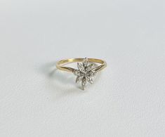 An Antique 14k Gold Flower Style Ring with Diamonds. Stones tested as natural stones.  All items are XRay and Acid tested to ensure metal authenticity. All pieces in this store are solid gold in the purity listed unless otherwise stated.  Weight: 1.4 grams Ring Size: 4.75 (resizing available upon request) Band Width: 1.1mm Art Ring, Flower Fashion, Gold Flowers, Rings Statement, Natural Stones, Solid Gold, Statement Rings, Ring Size, Jewelry Rings