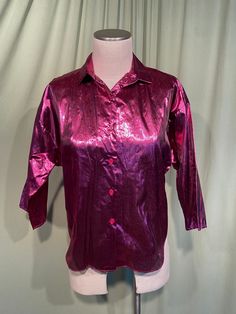 "This is a fun vintage blouse from the 1970s or 80s. It is deadstock, never laundered or worn, tags are still crisp. Labeled, \"Turn On\". Tagged a size Medium. The bust measures 40\", but it would look best on a slightly smaller bust. Please see measurements below. Made of a raspberry pink metallic & nylon with a shimmer or shine. Buttons up the front. It has 3/4 length sleeves & dropped shoulders with extra wide arm openings & the collar is a small cutaway style collar. The blouse is in very g Minimalist Blouse, Vintage Blouses, 90's Fashion, Pink Metallic, Raspberry Pink, Vintage Blouse, Short Sleeve Cardigan, Knitted Tshirt, Short Sleeved Sweaters