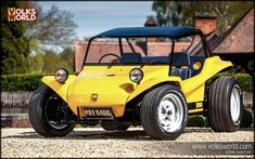 a yellow and black buggy parked in front of a house