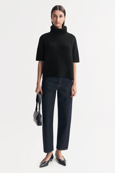 Short sleeve ribbed knit turtleneck knitted in 100% cashmere. - Rib knit - Regular fit - True to size - 3 gg - 12 ply - 100% Cashmere Model is wearing size S and is 177 cm tall. Workwear Ribbed Cashmere Turtleneck, Ribbed Cashmere Turtleneck For Work, Casual Cashmere Turtleneck For Work, Cashmere Turtleneck Top For Work, Short Sleeve Turtleneck, Knit Turtleneck, Cashmere Turtleneck, Ribbed Turtleneck, Rib Knit