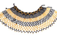 Big black and gold African beaded tribal chest piece choker statement necklace.One-of-a-kind and handmade by the Maasai Tribe in Kenya.Made from black and gold Maasai beads.Measuring approximately 54 cm across and 19 cm long.The choker top measures 27 cm with a beaded clasp, adding up to an additional 5 cm with the 2 different adjustable sizes.A serious statement piece.Fit for an Empress. Bohemian Black Choker With Large Beads, Black Beads With Gold Details For Festival, Black And Gold Beads For Festival, Bohemian Black Bib Necklace With Colorful Beads, Black Bohemian Bib Necklace With Colorful Beads, Black Festival Choker With Large Beads, Festival Black Choker With Large Beads, Black Beaded Necklaces With Gold Beads For Festival, Traditional Black Choker With Colorful Beads