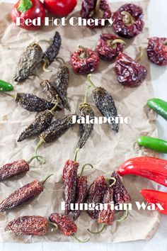 the different types of peppers are displayed on paper