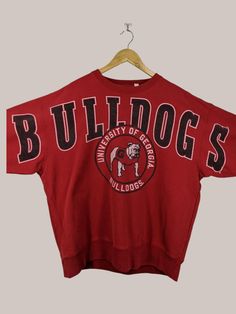 Vintage NCAA Georgia Bulldogs Football University Sweatshirt Georgia Crewneck Georgia Sweater Printed Logo Red Color Men's XXL Label : Tailgate Label Size : XL (Refer Masurement) Made in Pakistan Materials from 100% Cotton Used Item With Condition 7/10 Refer Picture. Stain and No Holes. Lay Down Flat Measurement : - Width (armpit to armpit) and: 27 inches - Length (shoulder to end of garment): 29.5 Inches We are selling used clothing with good condition. DO NOT EXPECT the item is like new condition. Shipping: DHL/FEDEX EXPRESS with TRACKING NUMBER. Track and Trace http://www.dhl.com http://www.fedex.com Parcel will be arrive within 3-6 business days or more due to location and custom clearing. Please PROVIDE your PHONE/CONTACT NUMBER for SHIPPING/DELIVERY purpose. VERY IMPORTANT ‼ for safe Georgia Bulldogs Football, Bulldogs Football, University Sweatshirts, Ncaa Football, Georgia Bulldogs, Used Clothing, Print Logo, Ncaa, Red Color