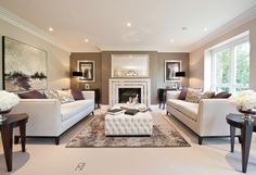 a living room filled with furniture and a fire place