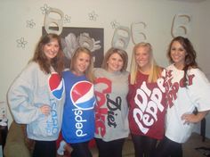 four girls in pepsi sweaters posing for the camera