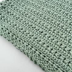 a close up view of a green crocheted cloth