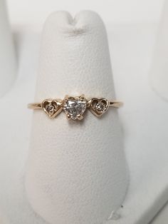 "Thanks for shopping our vintage estate store. We tend to sell well below wholesale and truly hope you enjoy all of our items. Many of the items are one of a kind, so please enjoy scrolling through the pictures and hopefully something will catch your eye. Black spots are from camera or reflections. Estate 10k yellow gold .25ct heart to hearts diamond ring appears from the 1970's or 1980's. The heart diamond is 4mm and .25ct and there are two small diamonds in the setting. Beautiful ring, one tha Heart Diamond Ring Engagement, Heart Diamond Engagement Ring, Heart Diamond Ring, Beach Rings, Diamond Ring Engagement, Sweet Ring, Gold Hamsa, Diamond Heart Ring, Heart Diamond