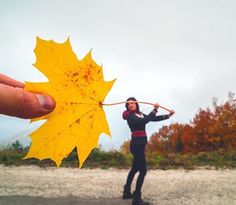 a person holding a yellow leaf in front of their face with the caption'i don't stop the dreaming '