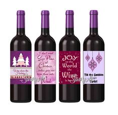 three bottles of wine with christmas decorations on the top one is purple and the other is red